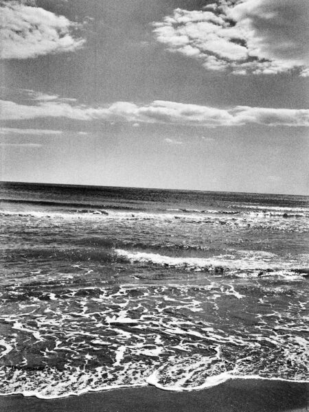Fine art picture showing waves running out on a beach in black and white