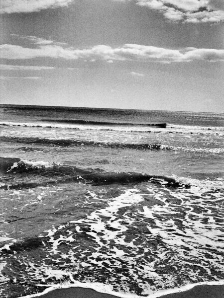 Fine art picture showing waves running out on a beach in black and white
